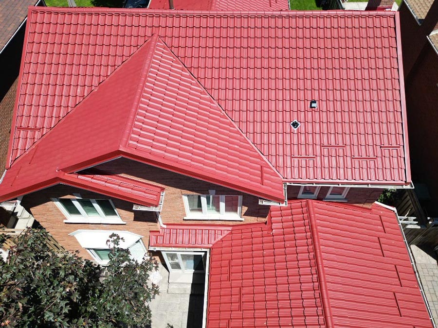 Metal roof replacement in Oakville with Enigma profile in red